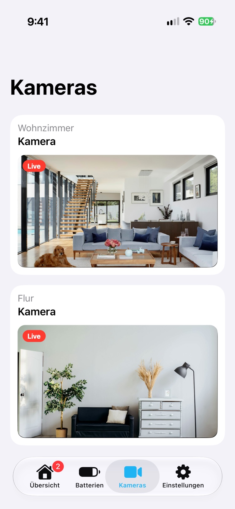 Der Tab Kameras mit zwei Kameras, Wohnzimmer und Flur, jede mit Livebild, dem Raumnamen darüber und einer roten Live-Markierung.